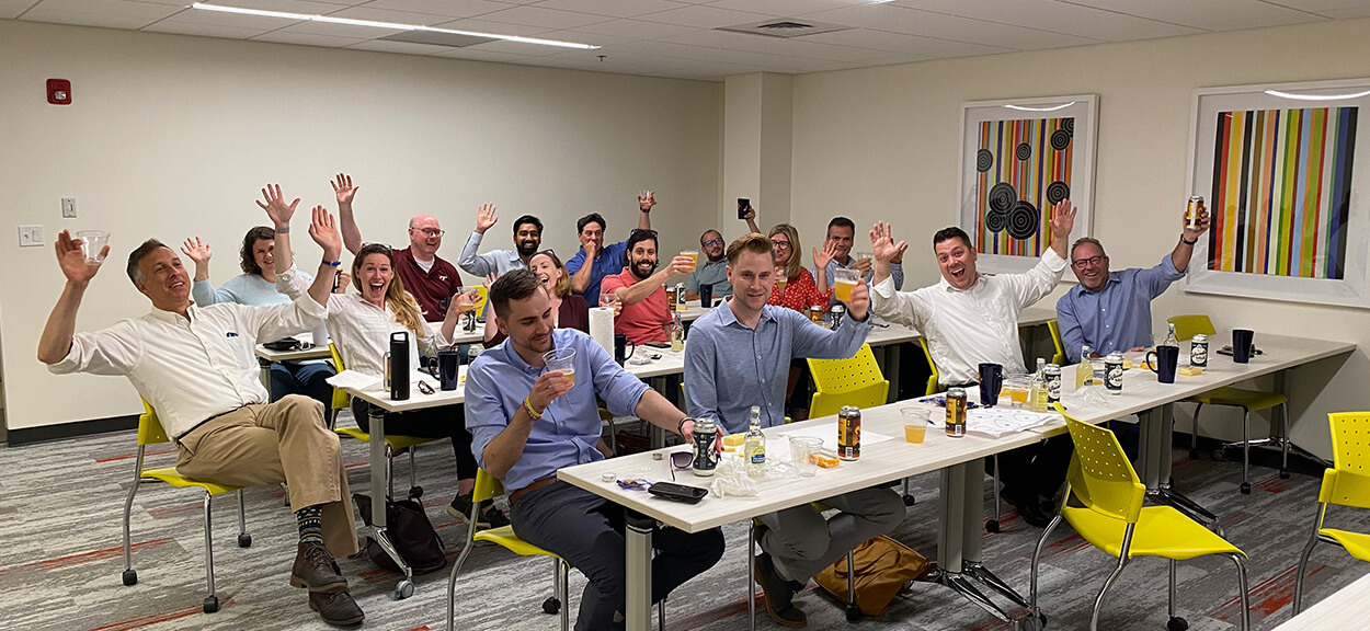 Company team having a meeting together with snacks