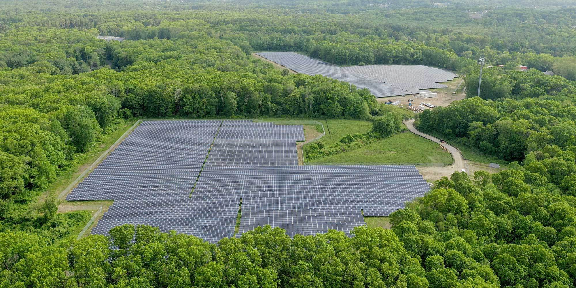 Aerial view of fields covered in solar panels