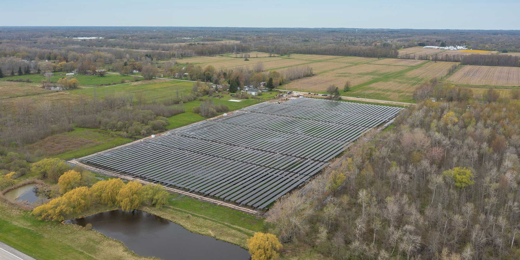 Large field with multiple rows of solar panels