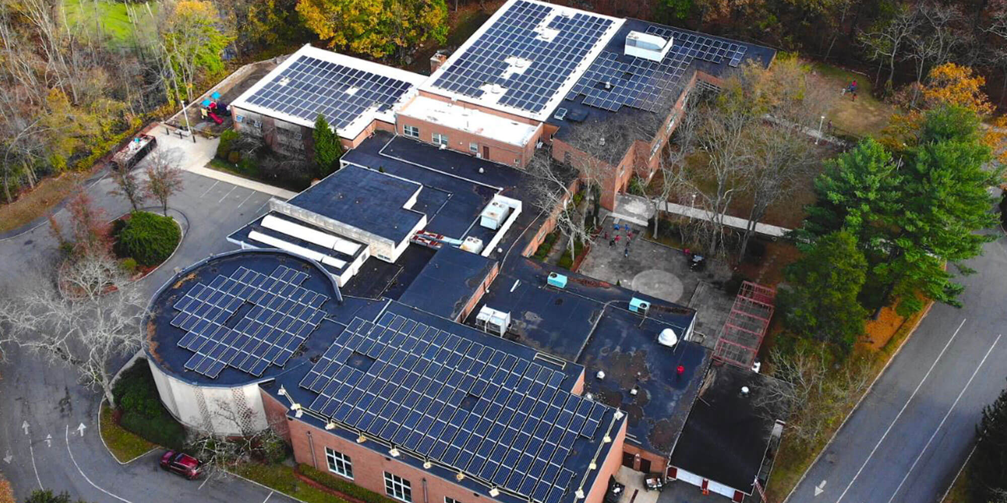 Brick commercial building with solar panels on the roof