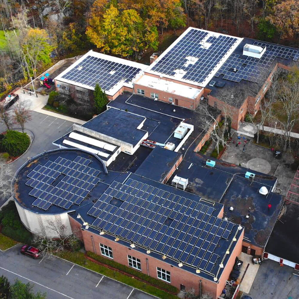 Brick commercial building with solar panels on the roof