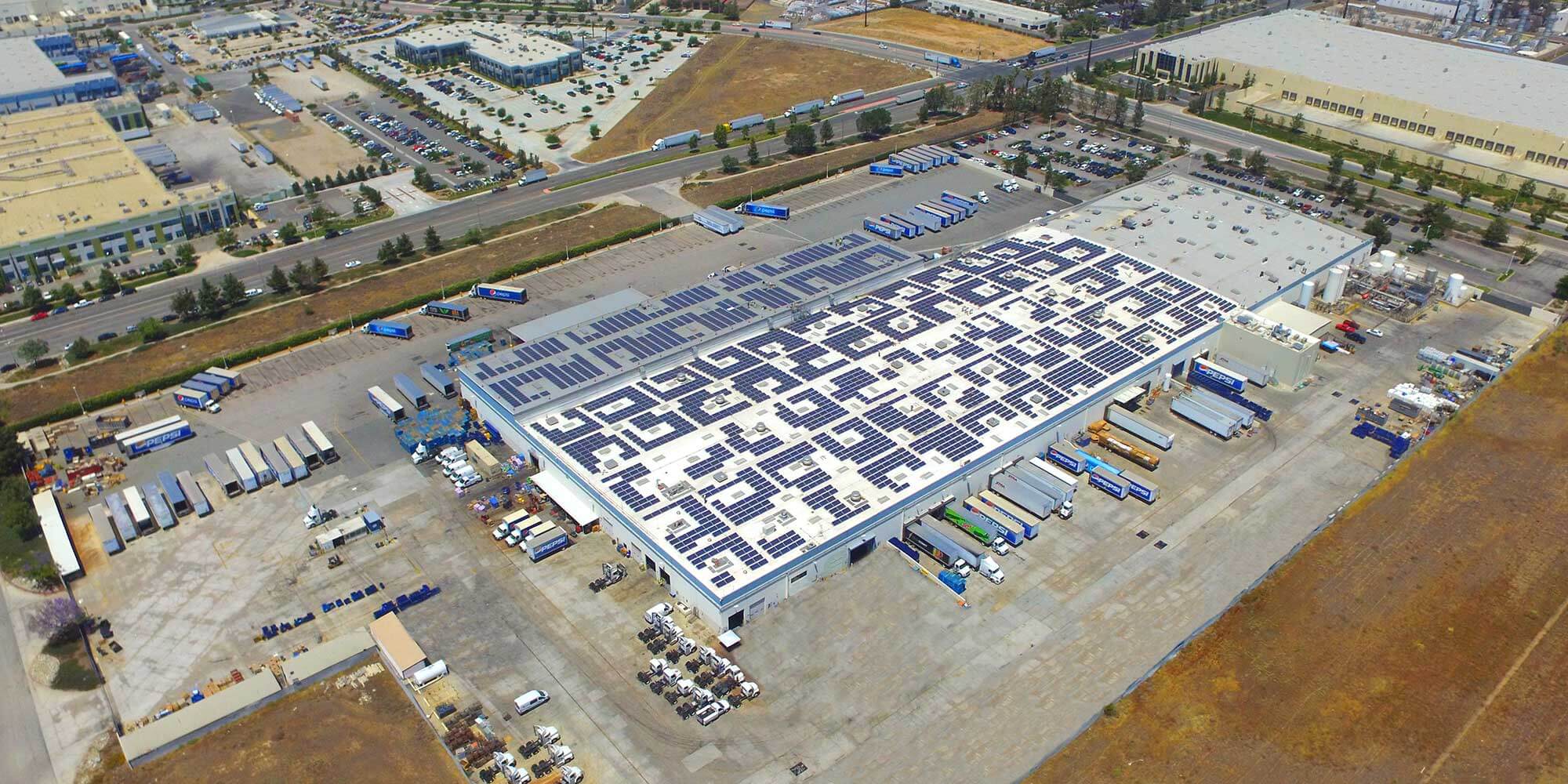 Aerial view of Pepsi business complex with box trucks outside