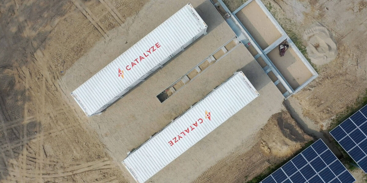 Drone view of two white shipping containers belonging to Catalyze