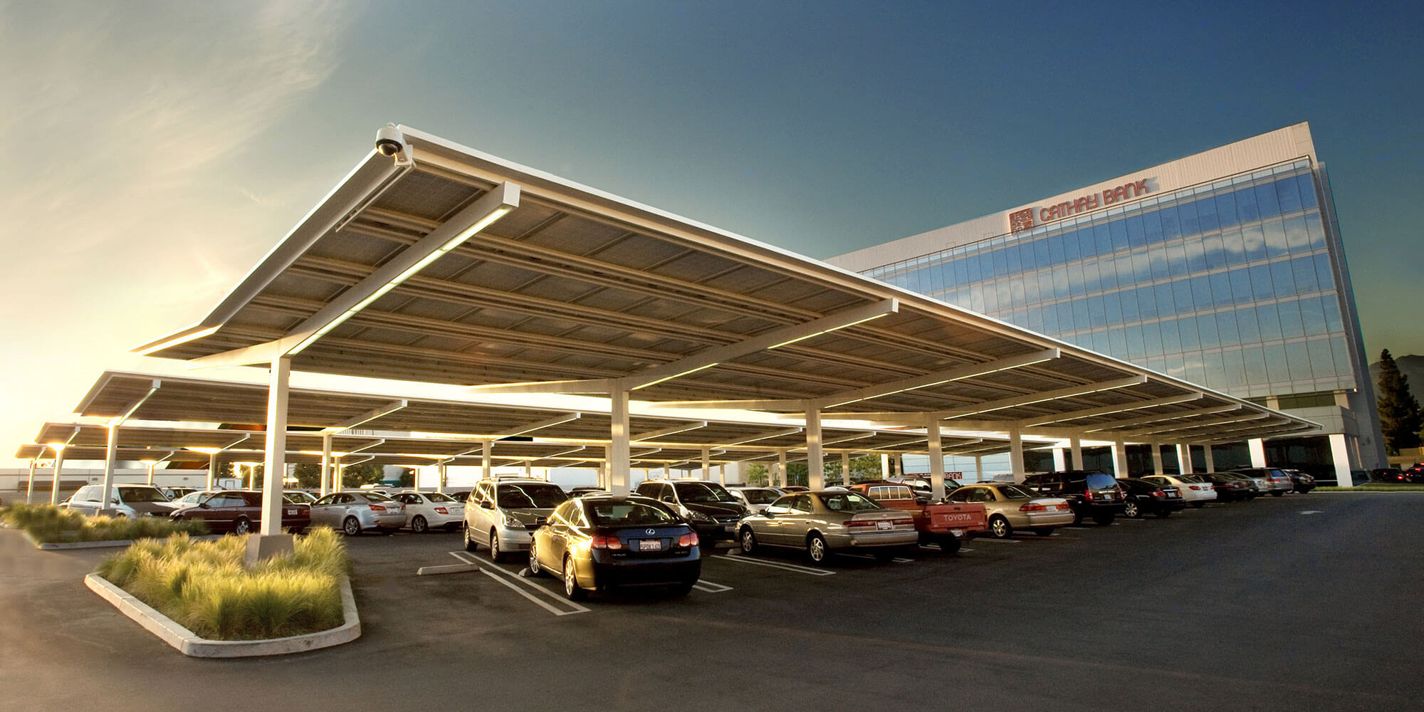 A roof-top solar panel set meeting a city skyline with blue sky