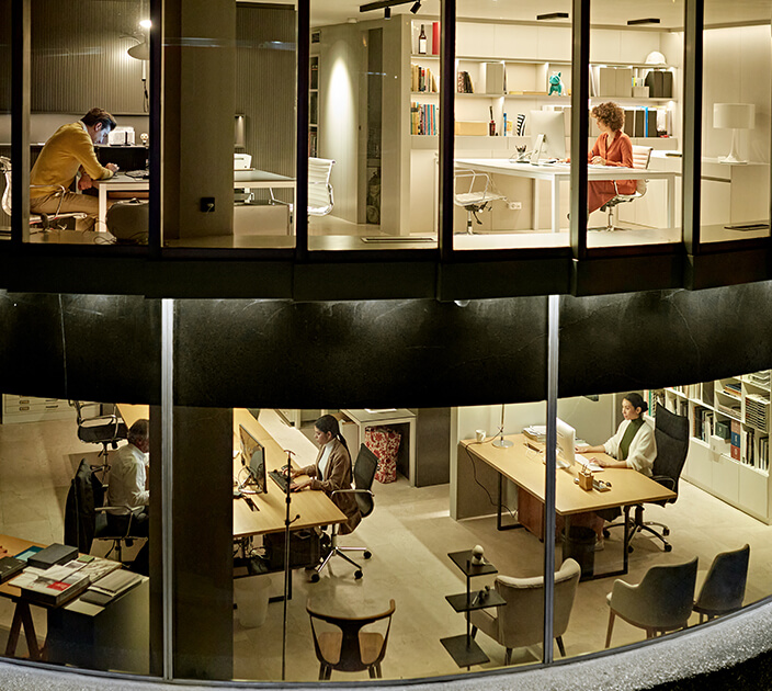 People working in a high-tech building powered by clean energy